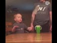 Child prodigy in the art of flipping bottles