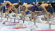 Michael Phelps (USA) gets ready for his leg during