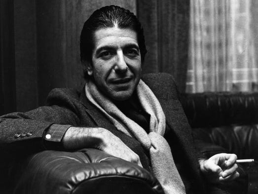 Leonard Cohen shares a joke and smokes a cigarette