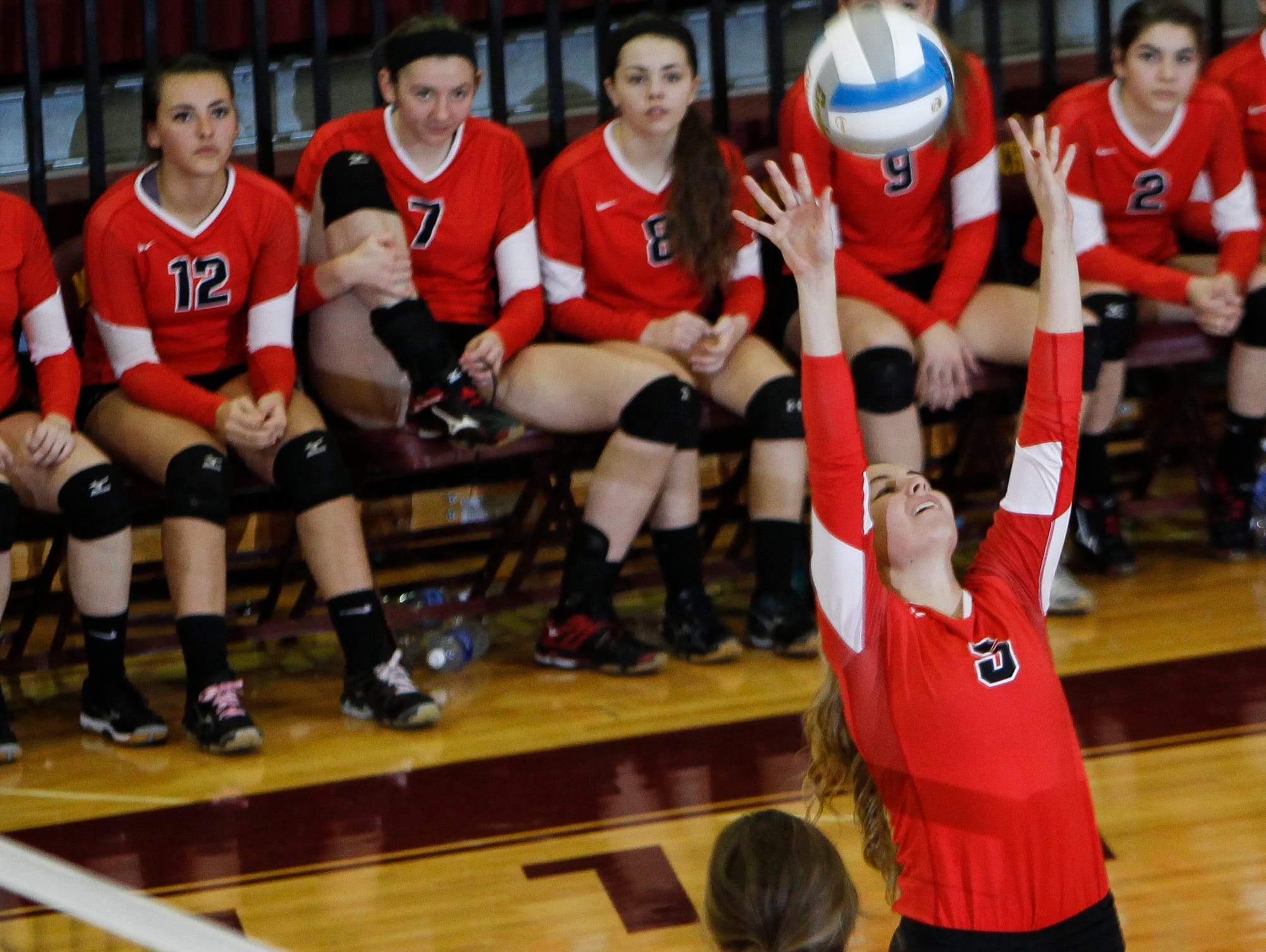Lindsey Smith of Laingsburg sets November 17, 2015, against SMCC during the Class C quarterfinal at Manchester High School. Monroe St. Mary Catholic Central won 3-1.