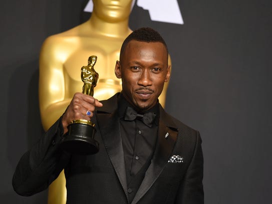 Mahershala Ali  with his award for best actor in a
