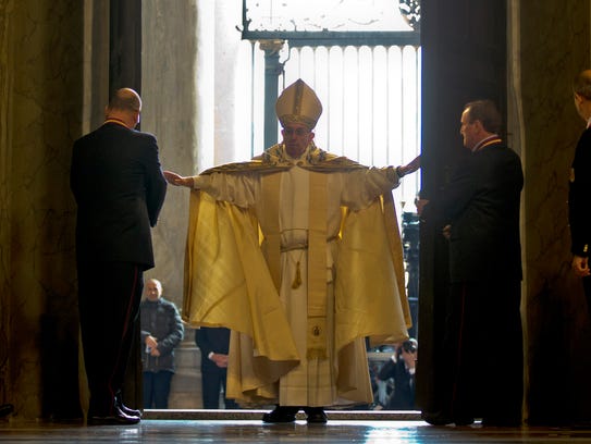 Pope Francis enters St. Peter's Basilica after pushing