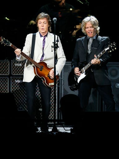 Paul McCartney performs during his 'Out There' world tour Tuesday, Aug. 12,  2014 at US Airways Center in Phoenix, Arizona.