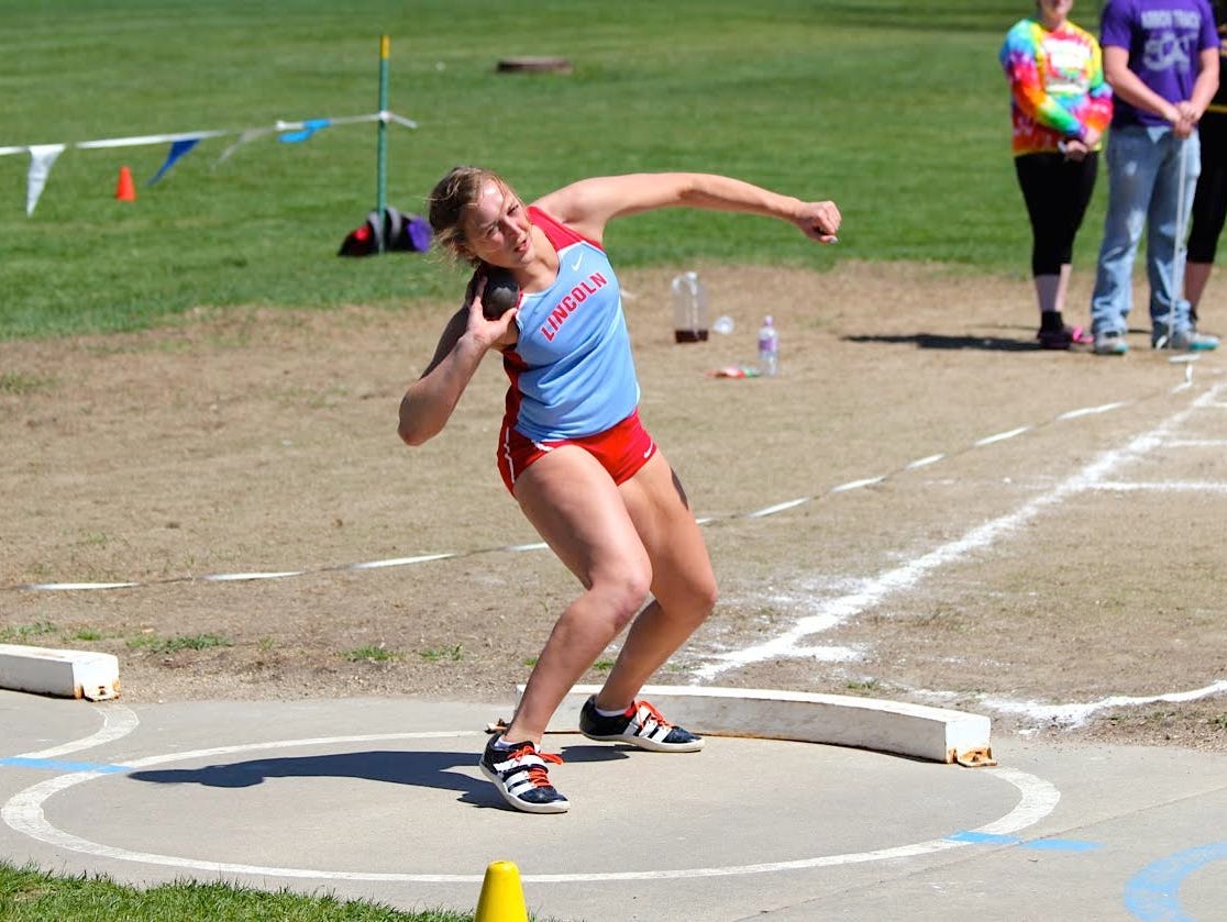 Lincoln's Izzy Van Veldhuizen competes in the shot put at a meet earlier this season. Van Veldhuizen holds the top marks in the state in both the discus and shot put.