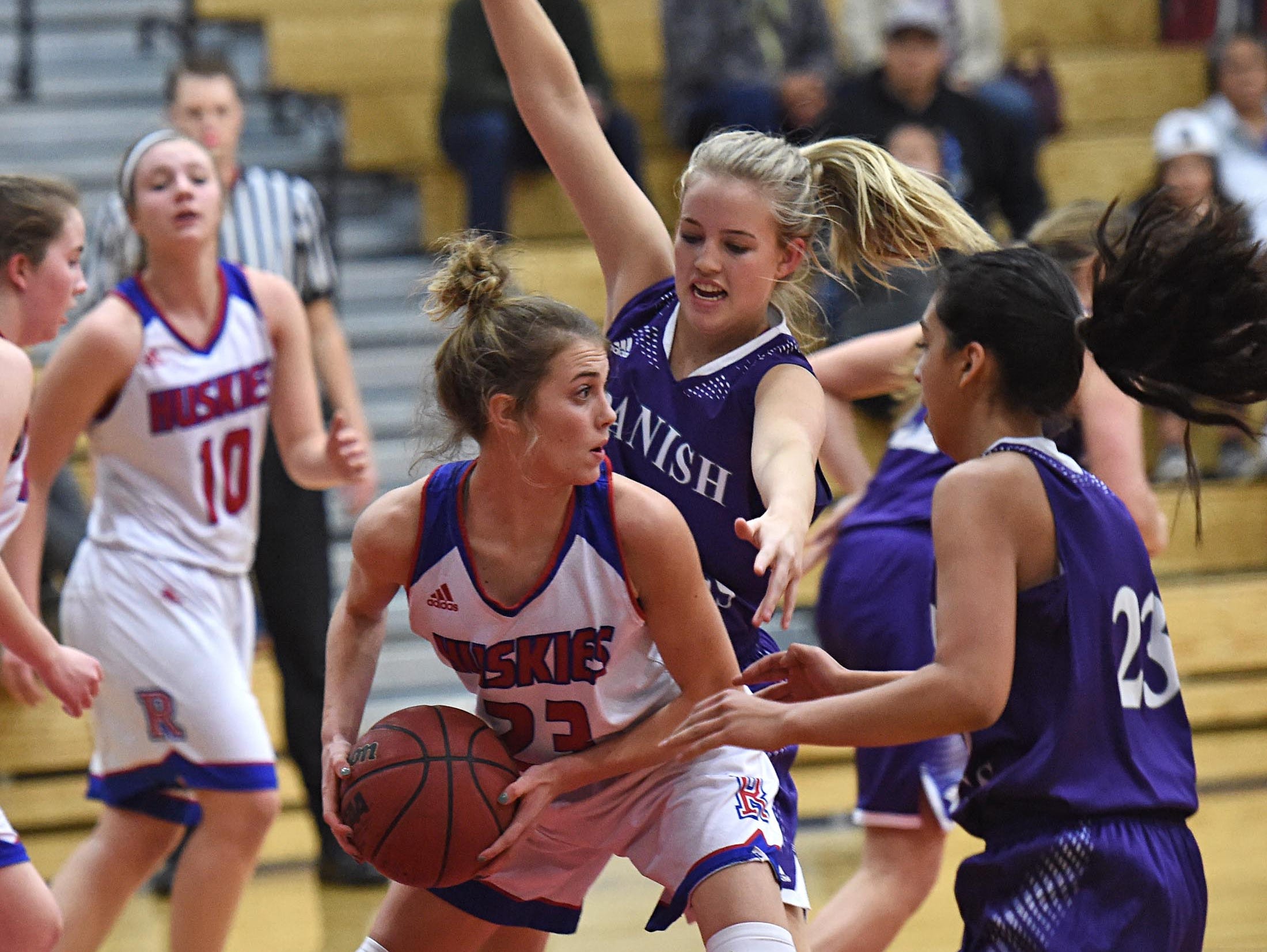 Reno's Mikayla Shults looks to pass the ball with Spanish Springs' Mackenzie O'Connell covering her in Tuesday's game at Reno High.