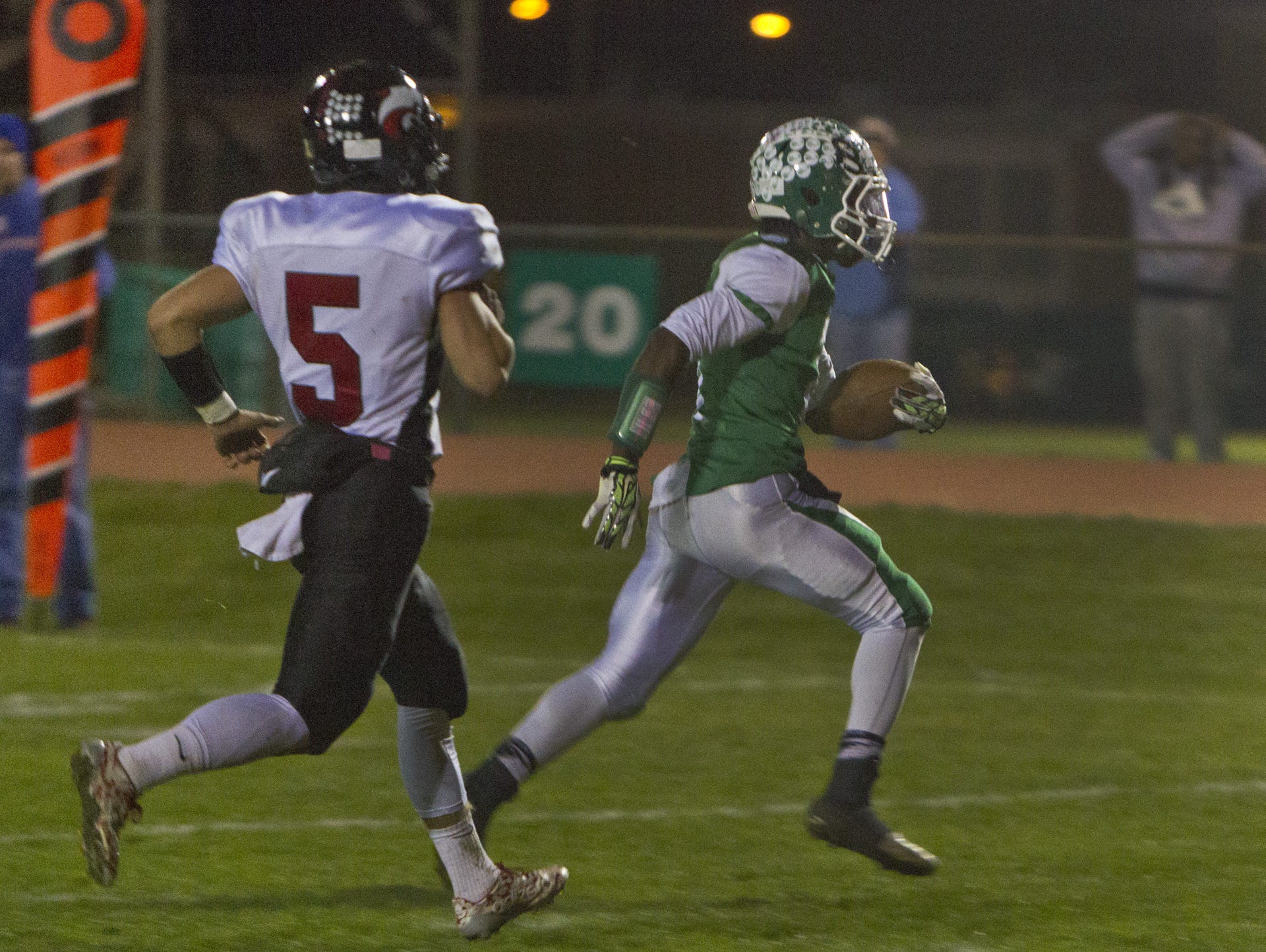 Brick's Ja'Sir Taylor catches a pass and takes it in for his team's first touchdown as Brick's Brandon Williams tries to catch him. Jackson Memorial vs Brick football in NJSIAA First Round Game in Brick NJ on November 13, 2015