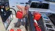 Jeff Beebe of Cape Canaveral fills gasoline containers,