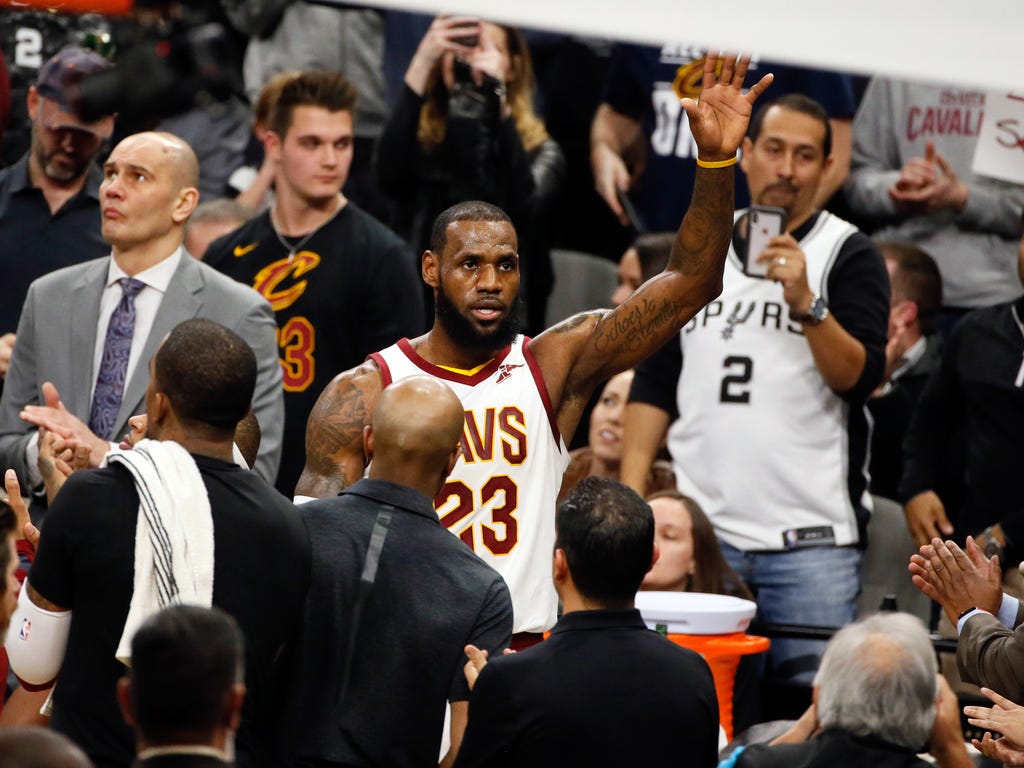 LeBron James celebrates after reaching the 30,000 career point scored milestone against the San Antonio Spurs at AT&T Center.