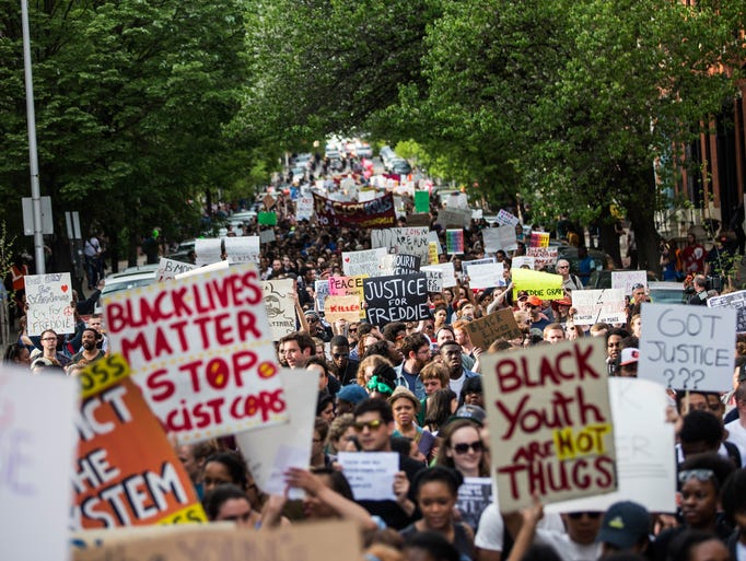 Students from Baltimore colleges and high schools march