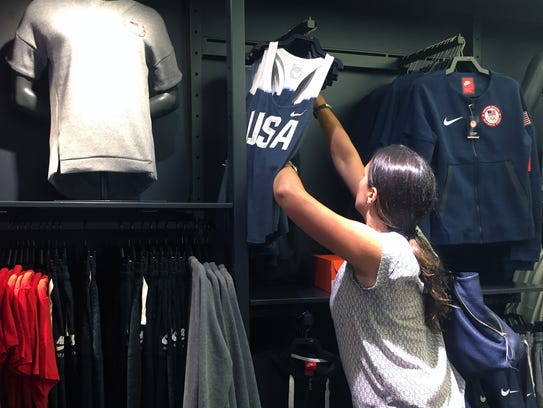 A customer shops for Team USA gear at a Nike store