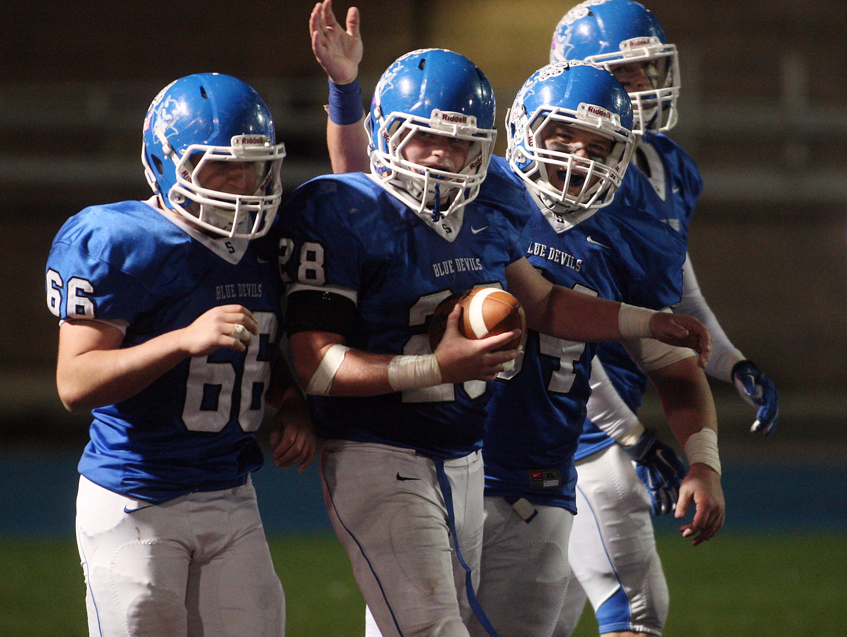 Shore Regional celebrates with Devin McLaughlin (28) after he scored late in the game vs. Palmyra in the NJSIAA Central, Group 1 Championship game at Kean University Alumni Stadium. The Blue Devils beat Palmyra 56-28. December 5, 2015, Union, NJ.