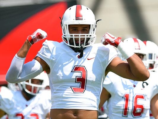 Darrien Beavers runs onto the field for Cincinnati Colerain prior to its game against Warren Central.