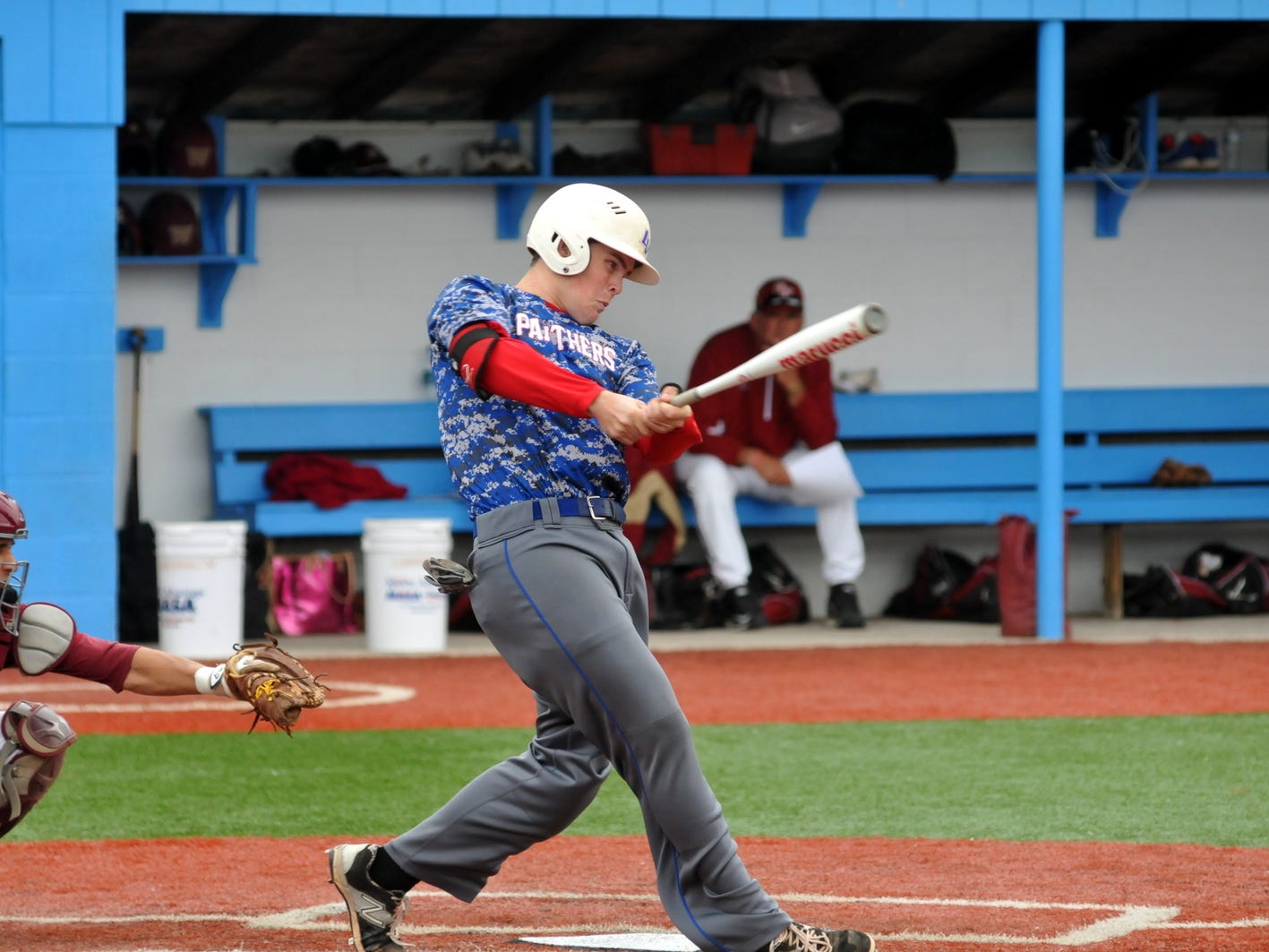 Licking Valley’s Jacob Dennis hits a first-inning RBI single Thursday at Lancaster’s Beavers Field. The Panthers lost 2-1 to Bishop Watterson in the Division II district finals.