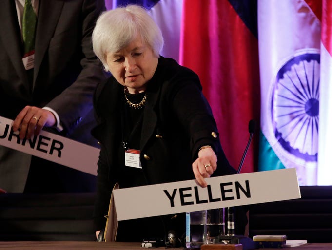 Janet Yellen, vice chair of the Board of Governors of the Federal Reserve System, places her name plate at her seat at the International Monetary Conference on June 3 in Shanghai. President Obama has selected Yellen to succeed Ben Bernanke as chairman of the Federal Reserve.
