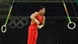 Shudi Deng (CHN) competes on the rings in the men's
