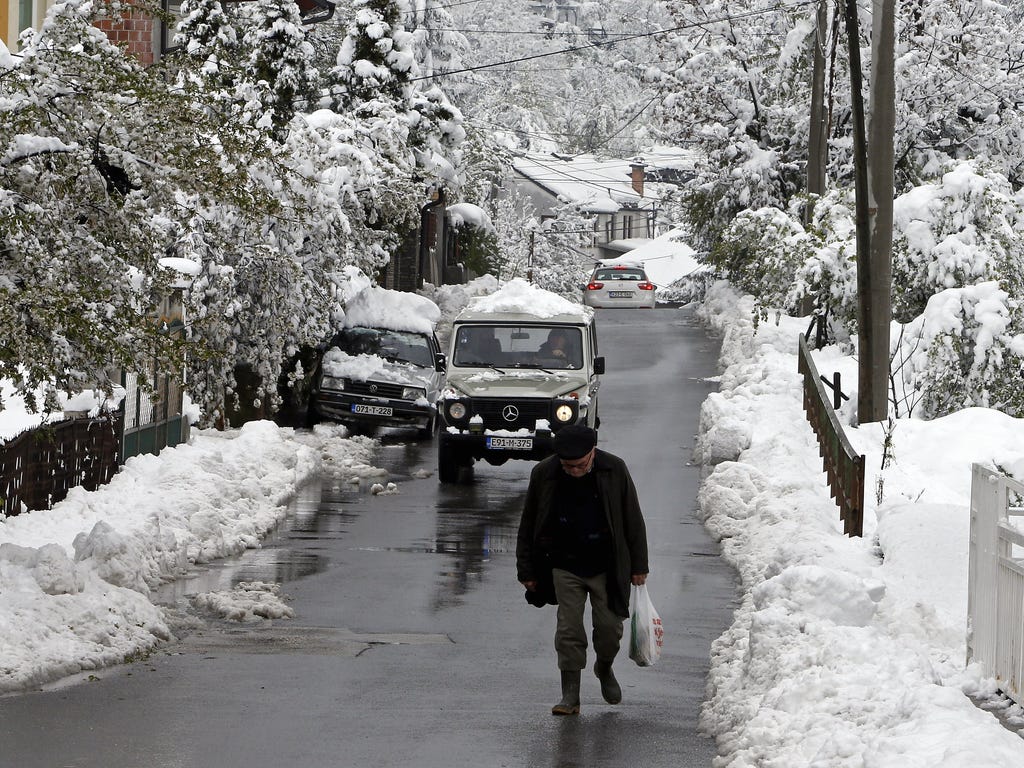 A man walks up a street in Sarajevo, Bosnia and Herzegovina as a cold snap hit the Balkans.