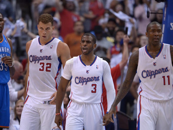 Game 4 in Los Angeles: Clippers 101, Thunder 99 --Clippers forward Blake Griffin (32), guard Chris Paul (3) and guard Jamal Crawford (11) react as Thunder forward Kevin Durant (35) watches.