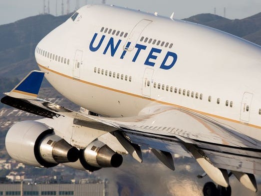 A United Airlines Boeing 747 takes off for Hong Kong