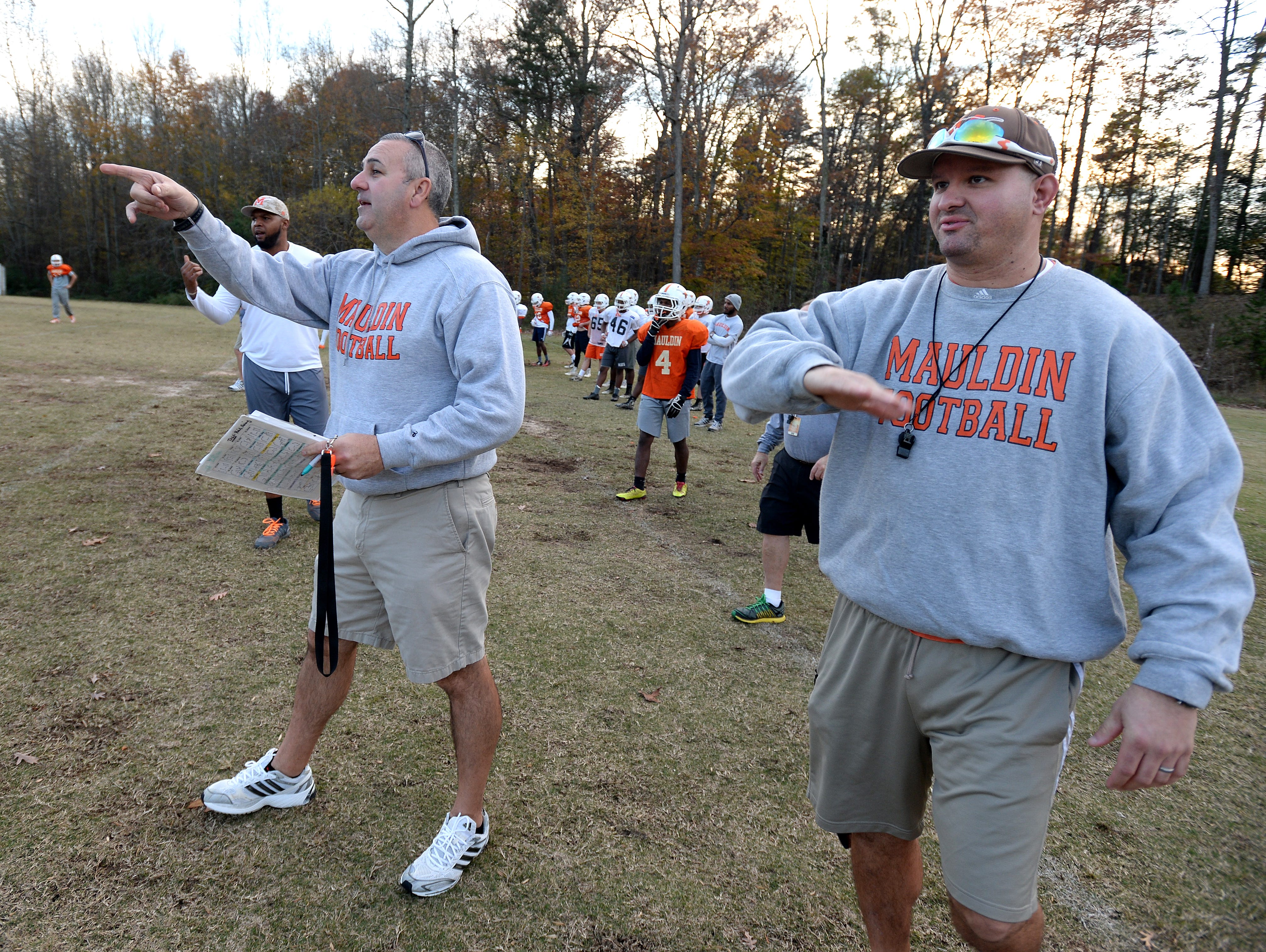 Mauldin head coach Lee Taylor, left, and assistant coach Brian Thompson call plays to the offense during the teams practice Monday, November 16, 2015. Mauldin will play Hillcrest in the 1st round of the AAAA playoffs Friday at Hillcrest.
