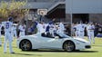 Mesa, Ariz.: Cubs players stretch with a Ferrari on