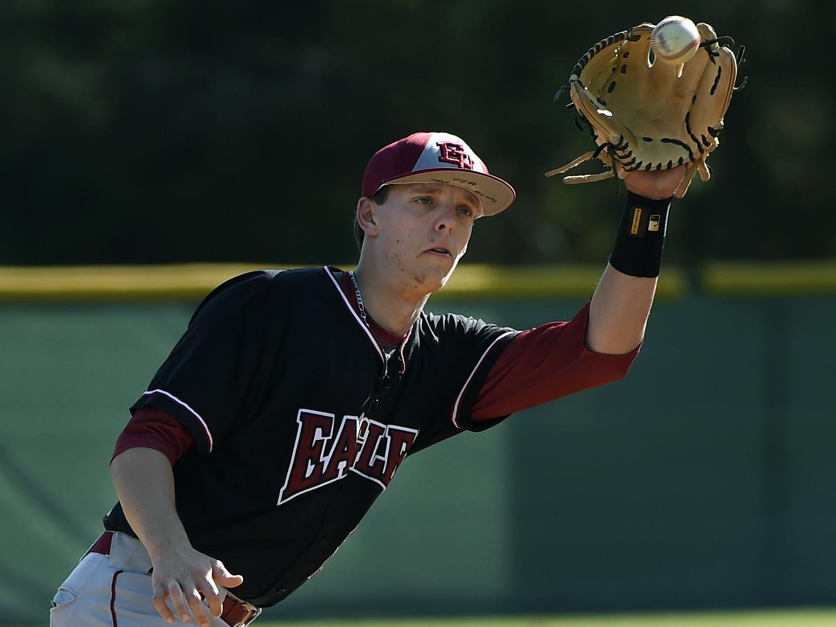 Ezell-Harding Christian School pitcher and third baseman, Grant Phillips warms up before a game baseball game on Thursday, April 28, 2016, in Nashville, Tenn. Wyse could not play as because of an ankle injury.