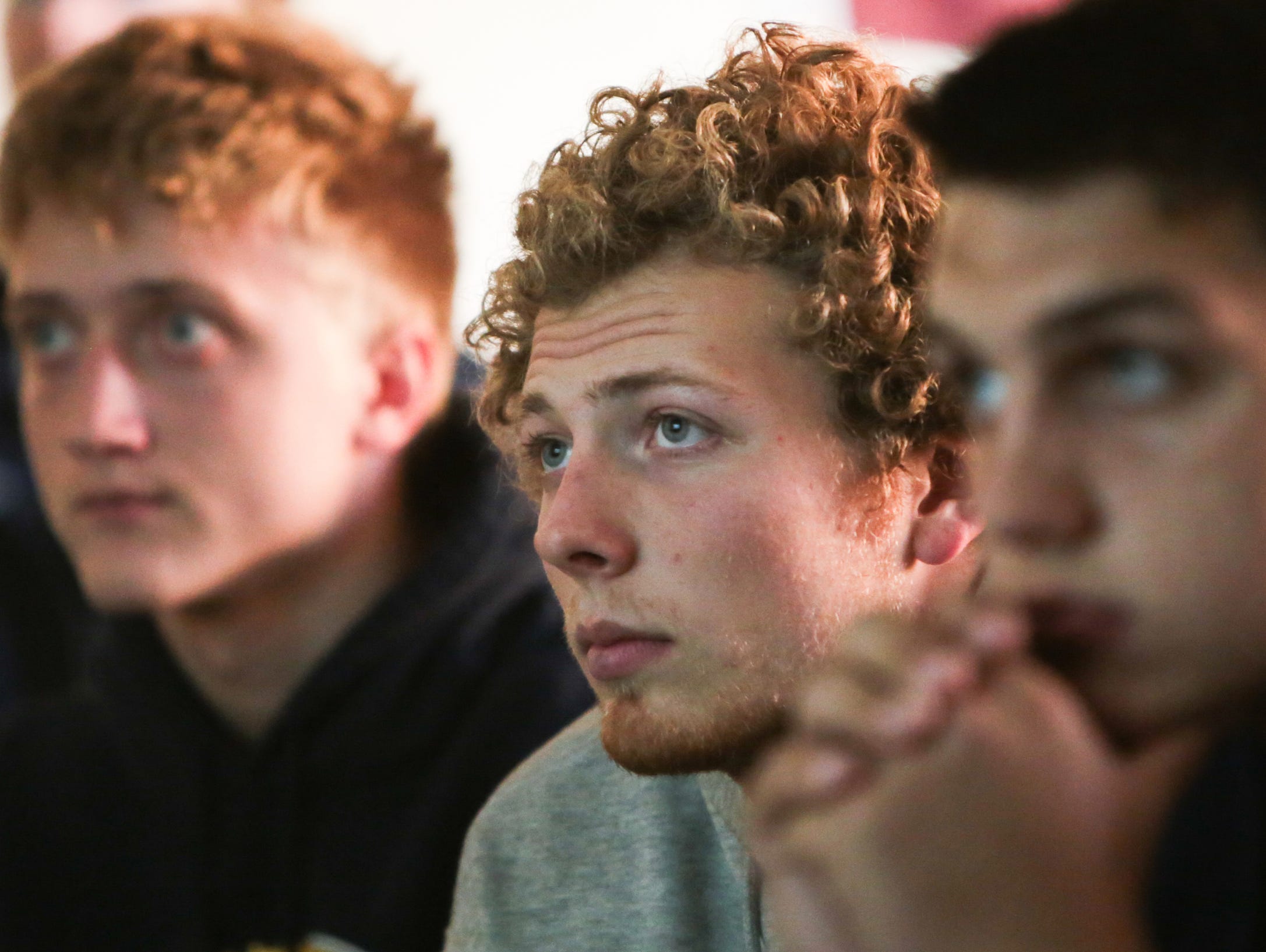 Pewamo-Westphalia running back Jared Smith (center) watches game footage with teammates during practice at Pewamo-Westphalia on Monday. Smith, who set the single-season rushing state record last year, has gained over 8,000 yards during his career.