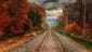 Awesome autumn: Clouds hover above train tracks on