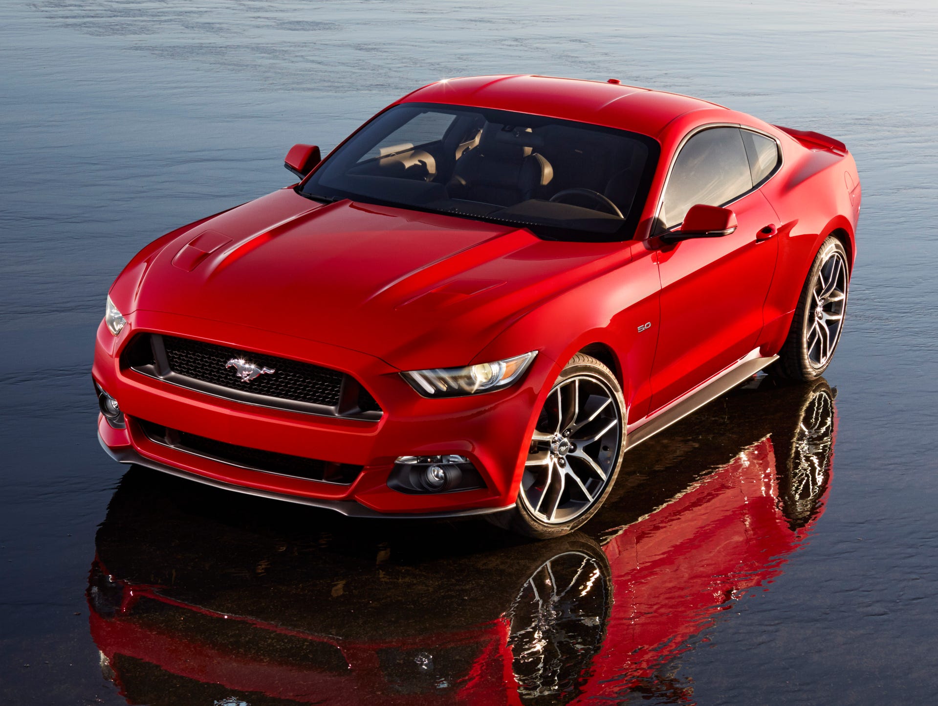 The redesigned 2015 Ford Mustang is to hit dealerships in the fall of 2014, a few months after the pony car's 50th birthday.
