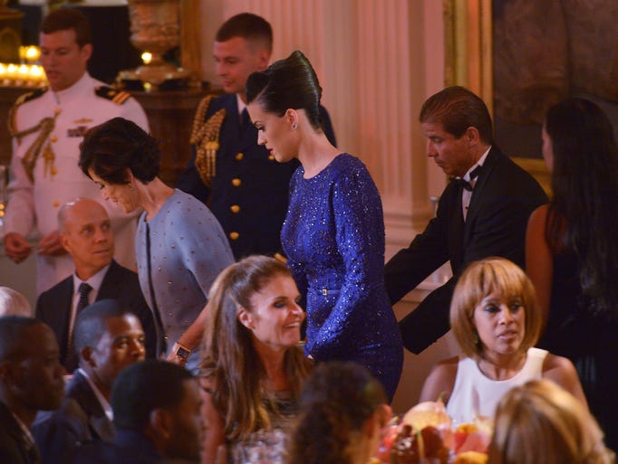 Singer Katy Perry (C) and her mother Mary Perry Hudson (L) arrive for a celebration for the Special Olympics on July 31, 2014 in the East Room of the White House in Washington, DC. Perry is rumored to be performing later in the evening. AFP PHOTO/Mandel NGAN        (Photo credit should read MANDEL NGAN/AFP/Getty Images)