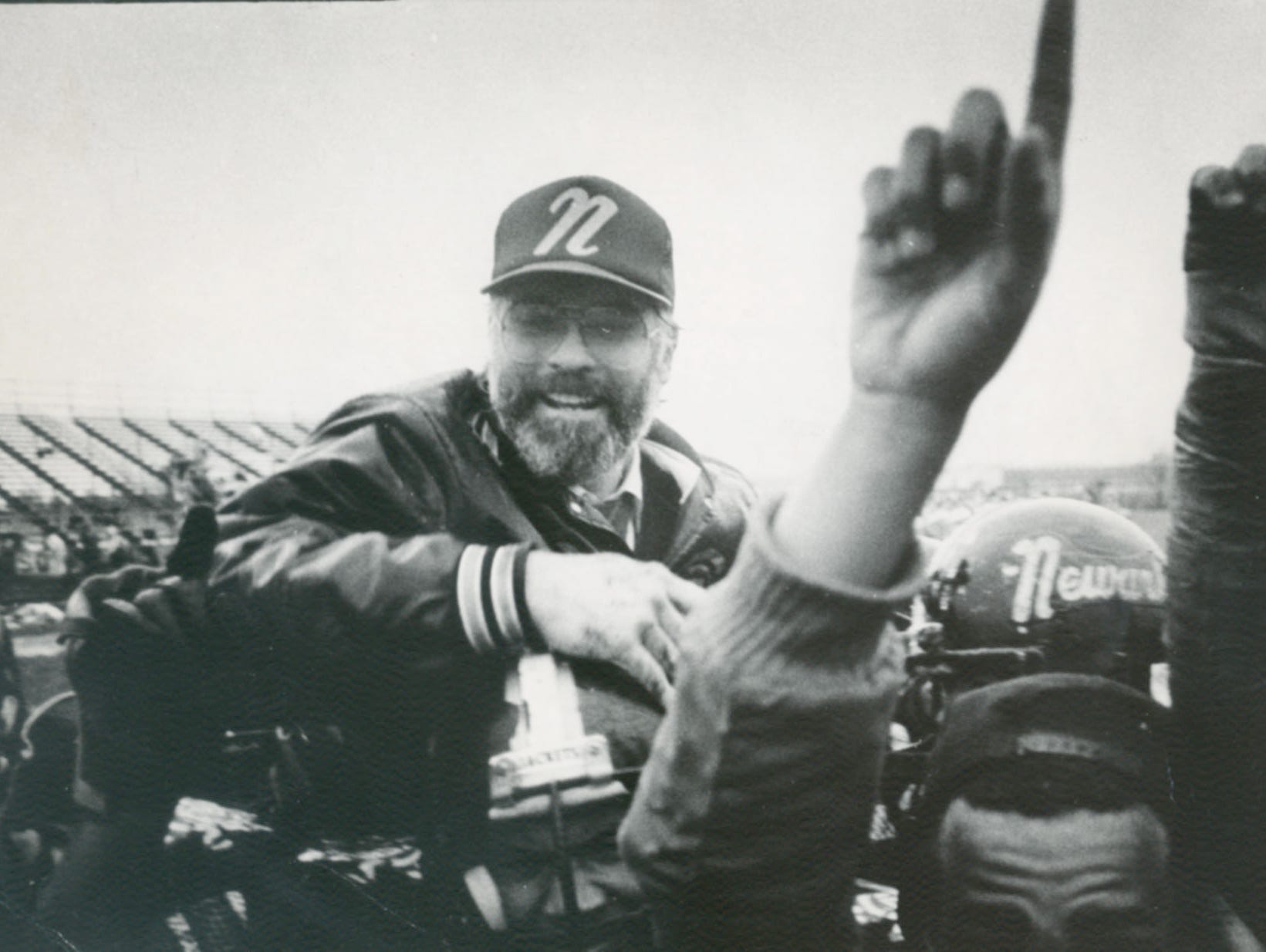 Butch Simpson celebrates with his Newark High players in 1985.