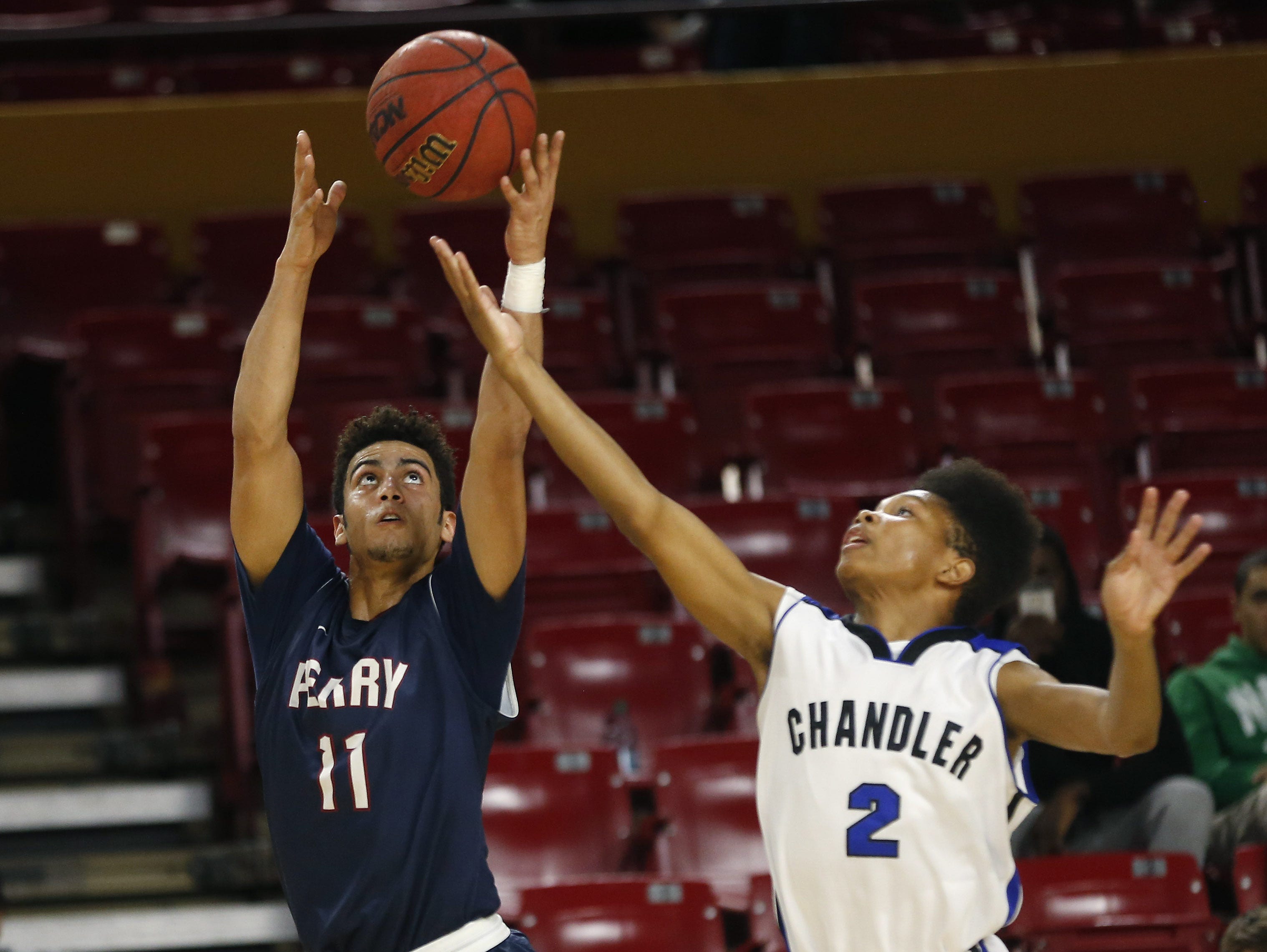 Perry High's Markus Howard (11) grabs a pass in front of Chandler High's Jalen Gibson-Starks during the MLK Basketball Classic at Wells Fargo Arena on Jan. 19, 2015.