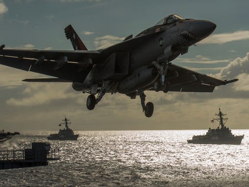 An F/A-18E with Strike Fighter Squadron 81 launches