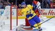 Team Sweden forward Henrik Sedin (33) takes a stick