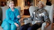 Nelson Mandela sits beside Secretary of State Hillary