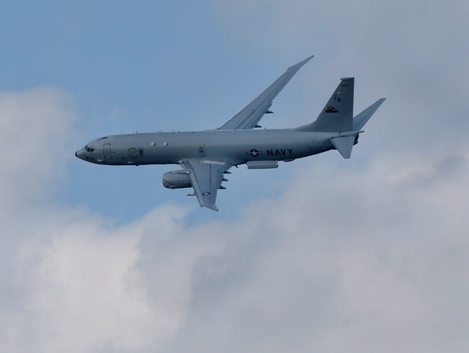 A Boeing P-8-A Poseidon flies during Farnborough Airshow on July 15, 2014.