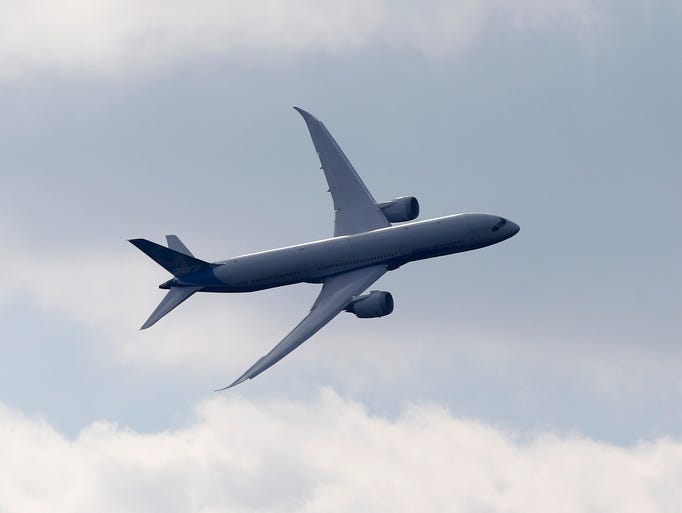 A Boeing 787 flies during the Farnborough Airshow on July 15, 2014.