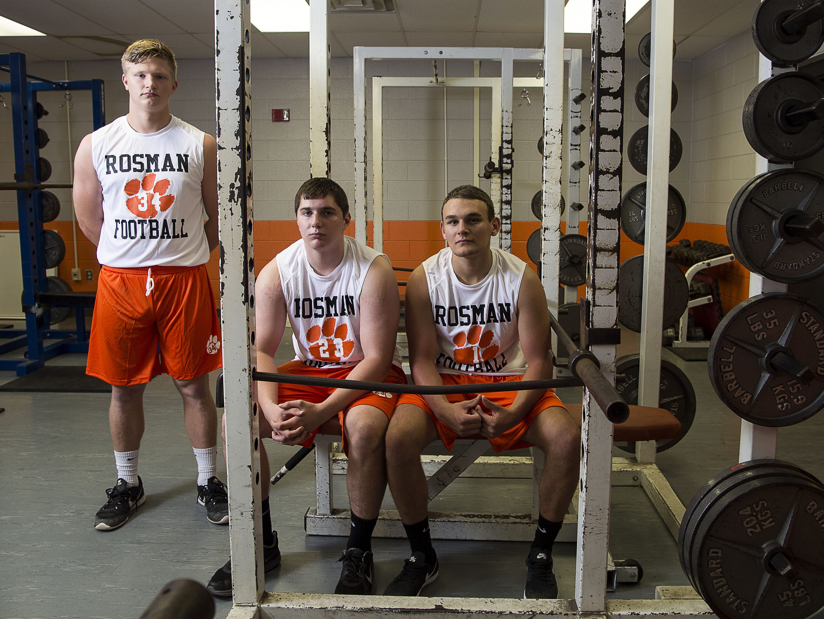 Rosman football players Neil Tesnow, Jonathan Holliday and Tanner Whitman.