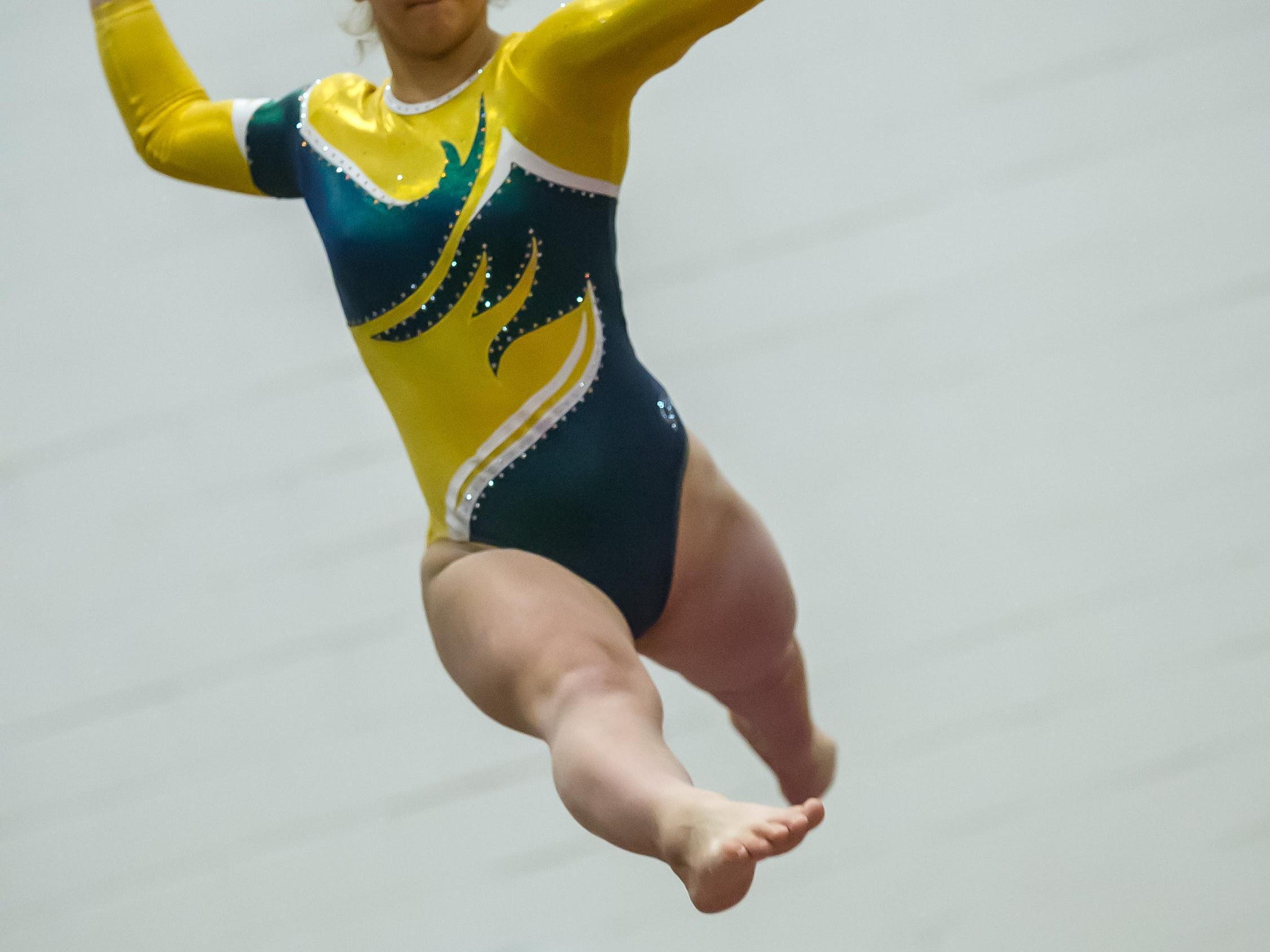 Red Bank Catholic's Ally Cucich competes on the beam in the NJSIAA Gymnastics state individual championship at Montgomery High School on Saturday Nov. 14, 2015. Photo by Jeff Granit