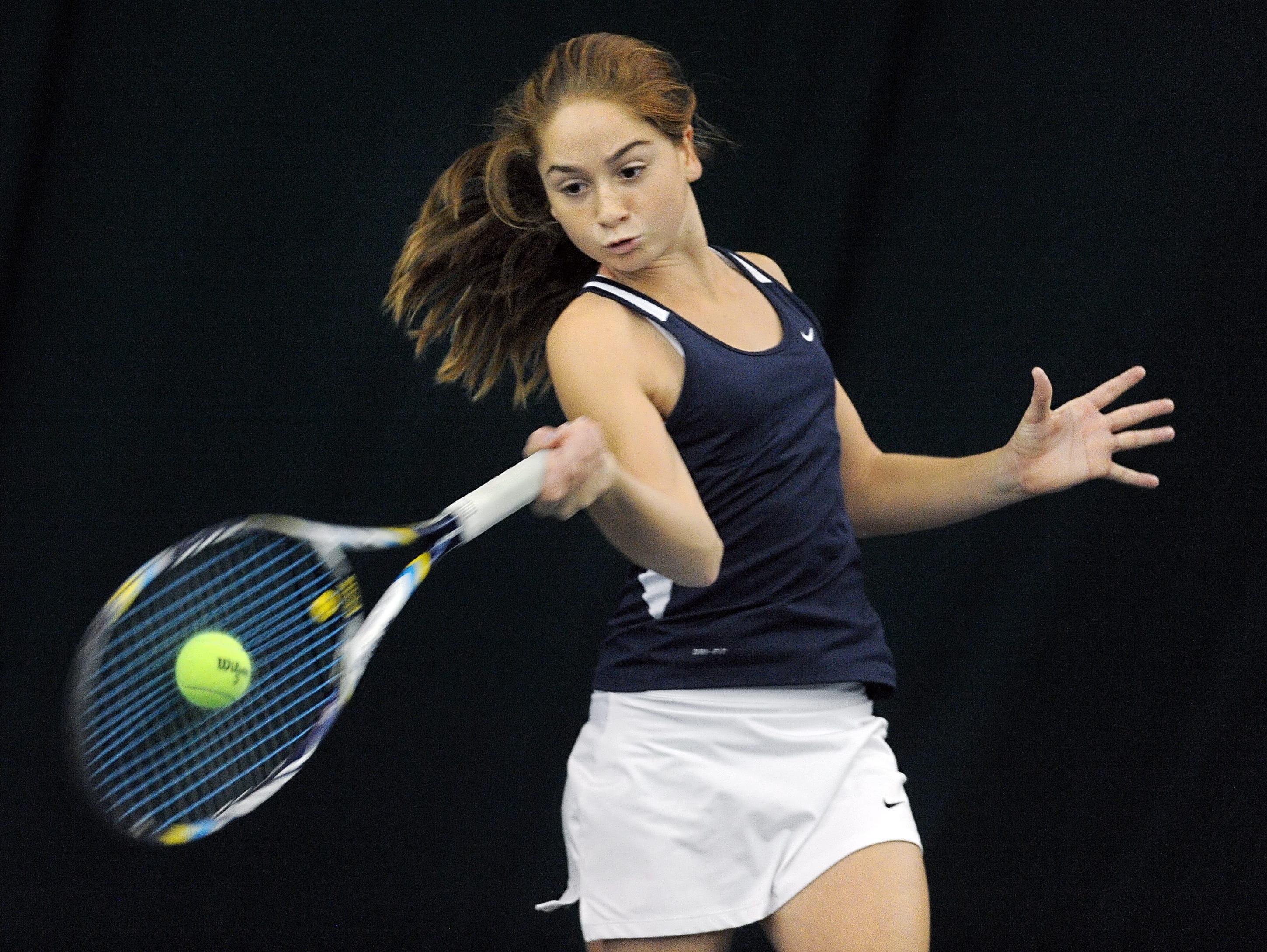 Mercy's Julia Andreach hits a forehand return on Oct. 25, 2014.
