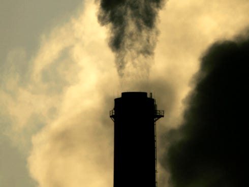Vapors spew from the smokestack at Sunflower Electric Cooperative's coal-fired power plant in Holcomb, Kan., in February 2007. A U.N. group warns of  