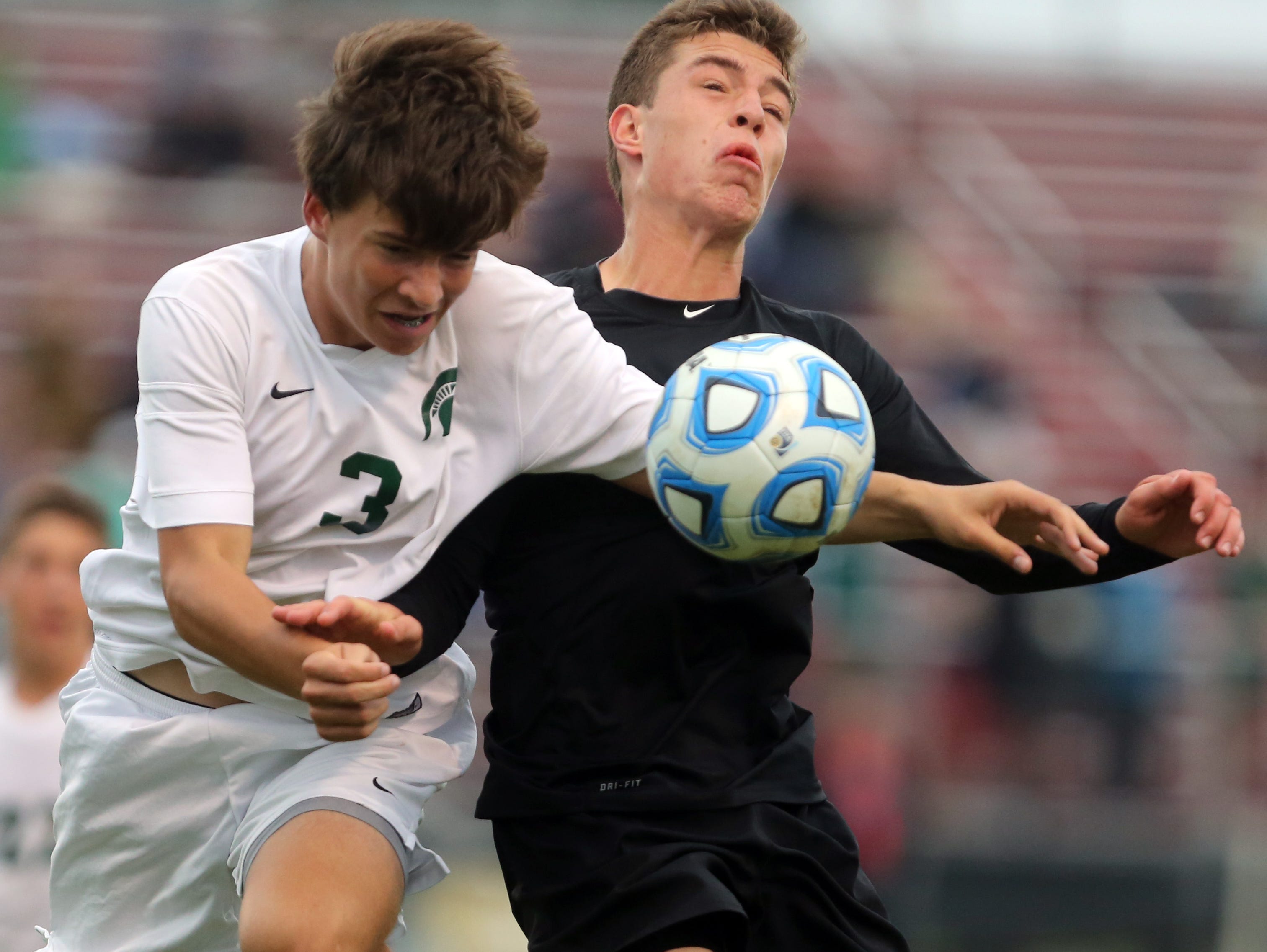 Battle Ground Academy's Jack Arnold fights for control of the ball with Webb School's Guthrie Bouchard-Dean during their Division II Class A soccer state final game.