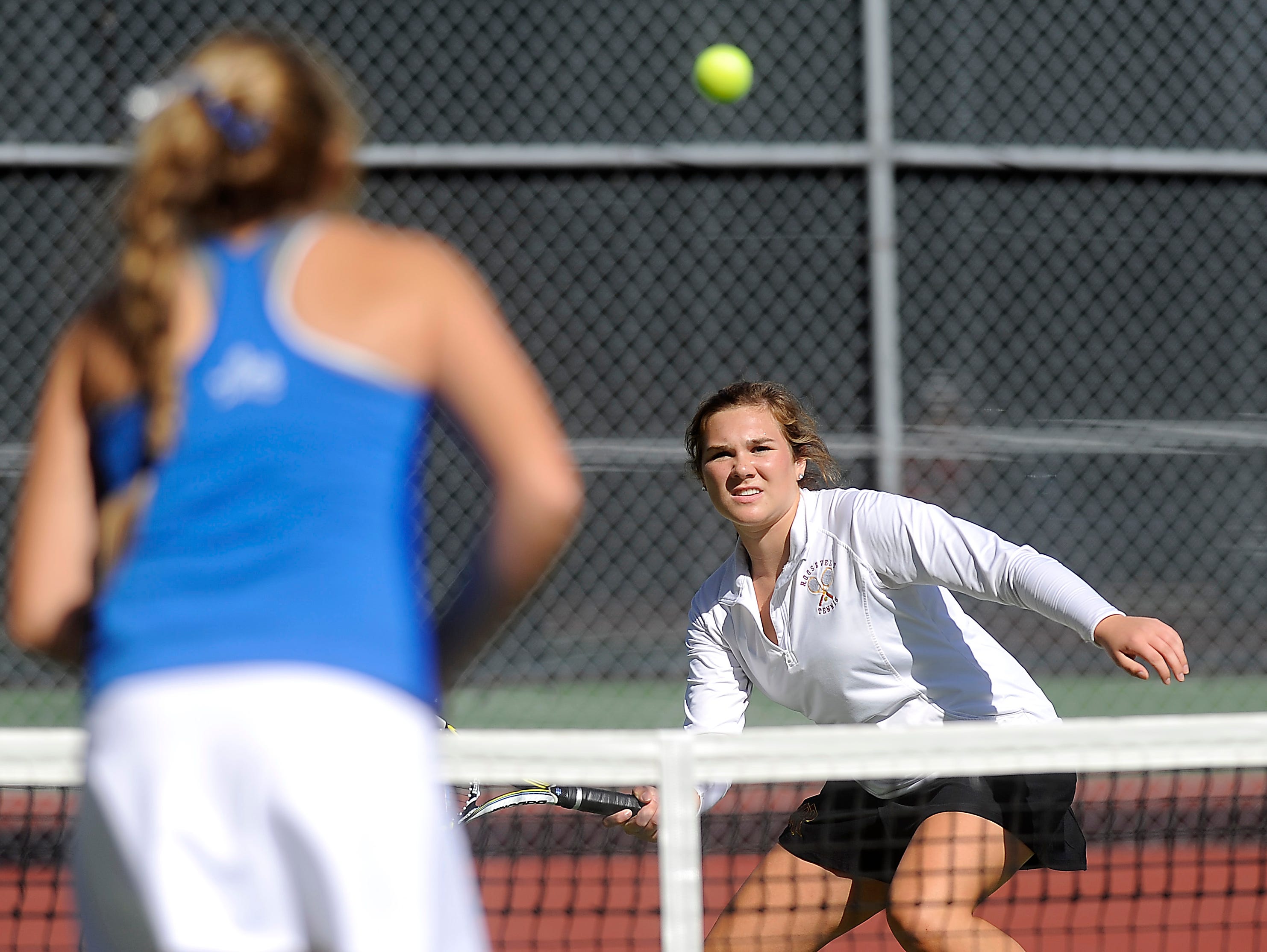 Roosevelt's Morgan Johnson returns the ball to Rapid City Stevens' Tianna Duba during doubles third round championship of the SD high school girls state tournament at McKennan Park in Sioux Falls, SD; Friday, Oct. 9, 2015.