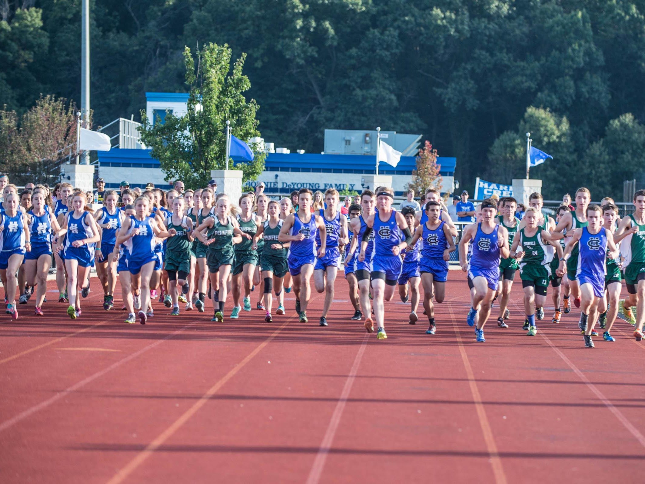 Harper Creek and Pennfield runners at the start of the cross country meet at Harper Creek Friday.