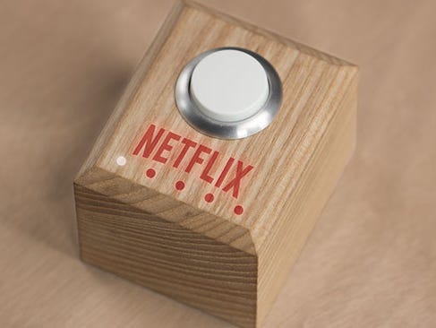 Yes, this is a real Netflix button. One press dims the lights and starts the app.