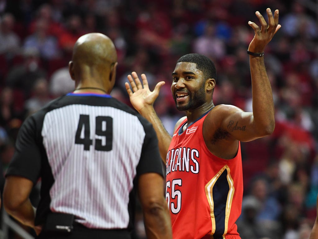 New Orleans Pelicans guard E'Twaun Moore reacts with referee Tom Washington during the second quarter against the Houston Rockets at Toyota Center in Houston.