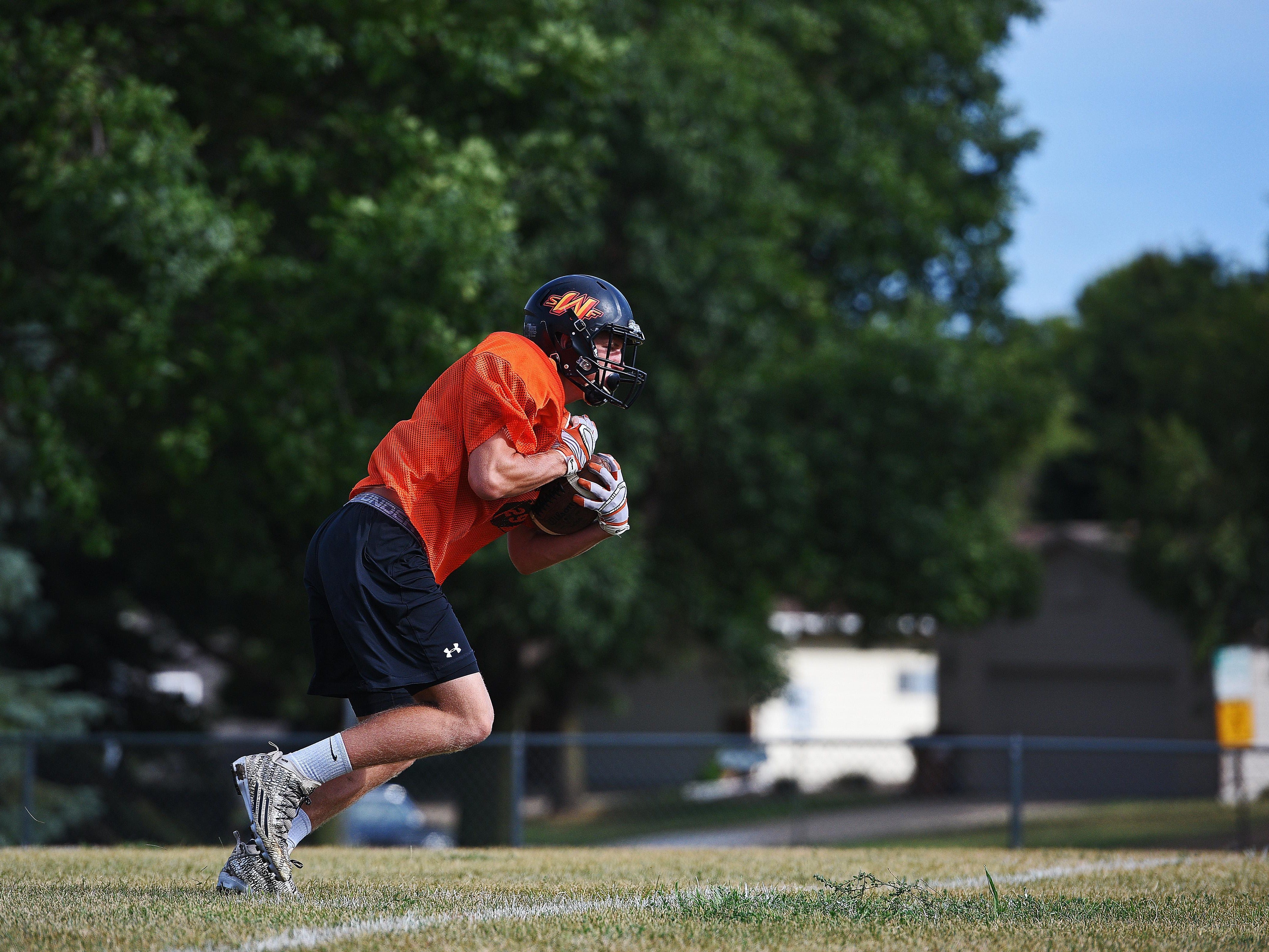 Washington's Logan Uttecht (29) takes part in a drill during a Washington High School Football Practice Thursday, Aug. 11, 2016, at Washington High School in Sioux Falls.