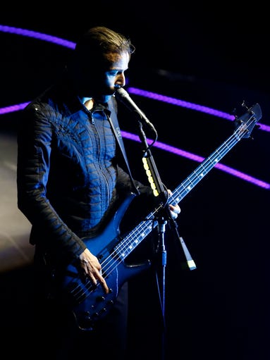 Chris Wolstenholme of Muse performs their Drones Tour