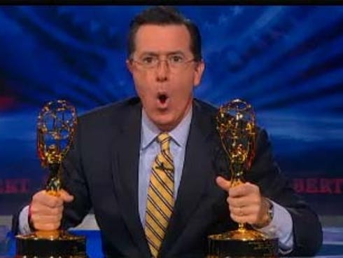 Stephen Colbert clutches his Emmy.
