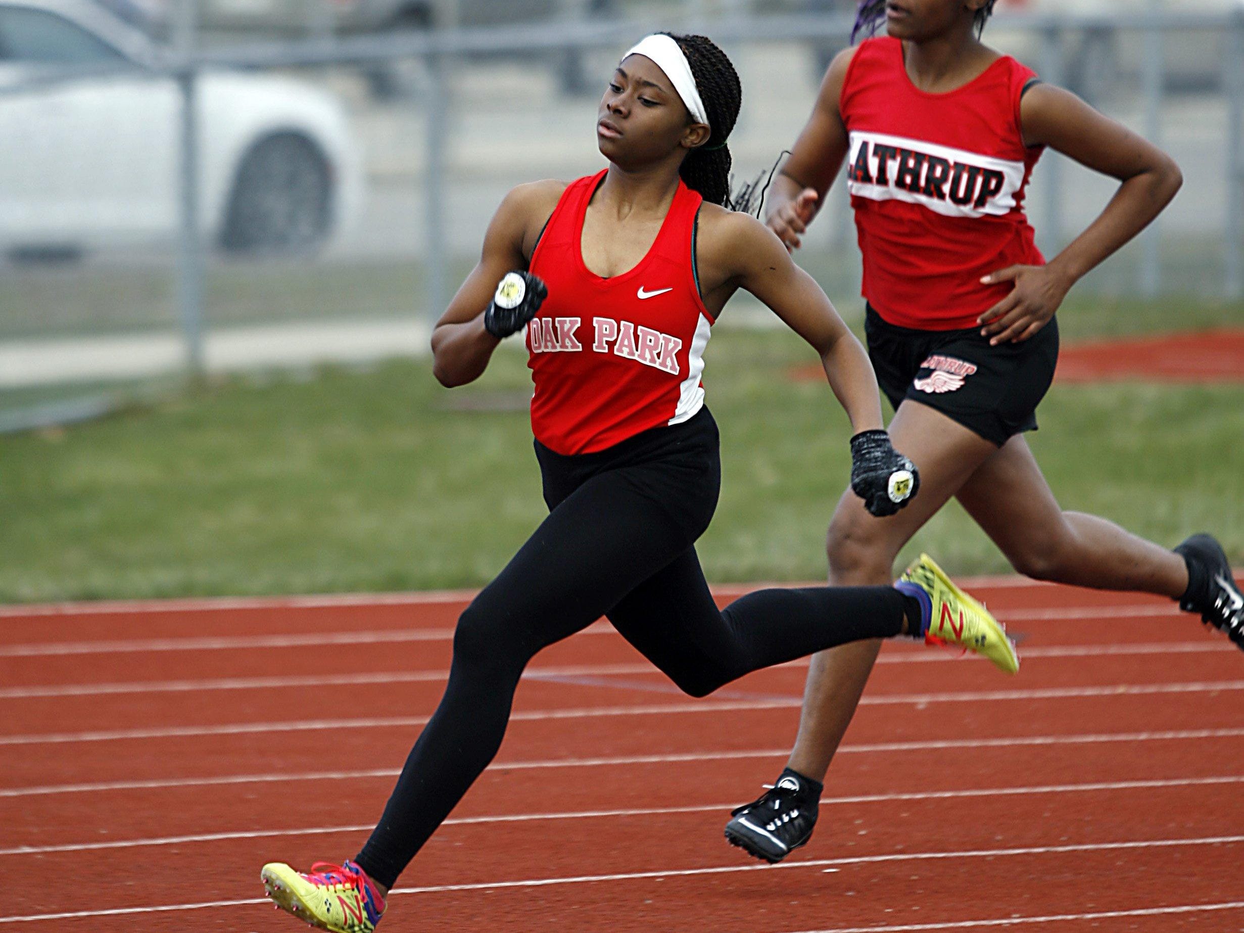Janae Barksdale races Southfield-Lathrup’s Autumn Hammond Wednesday. Barksdale is a fast freshman who should help the Knights remain a state power for years.