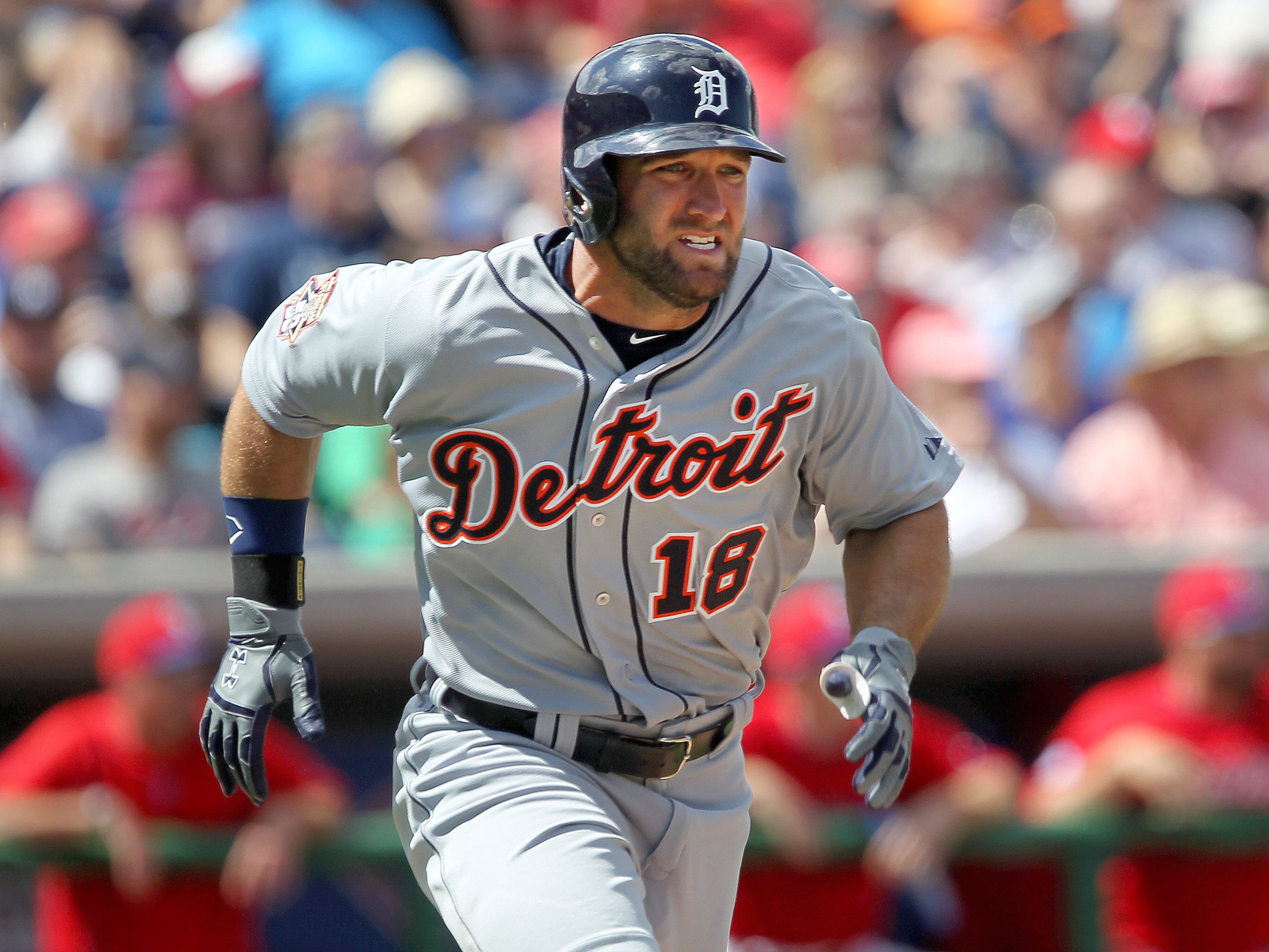 Tigers right fielder Tyler Collins (18) runs to first base during the second inning of a spring training baseball game against the Philadelphia Phillies at Bright House Field.